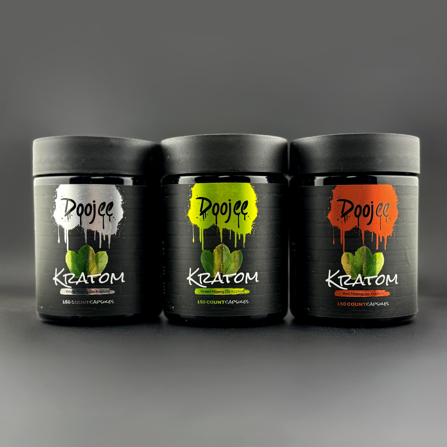 Three black bottles of Pojee Kratom capsules with colored labels.